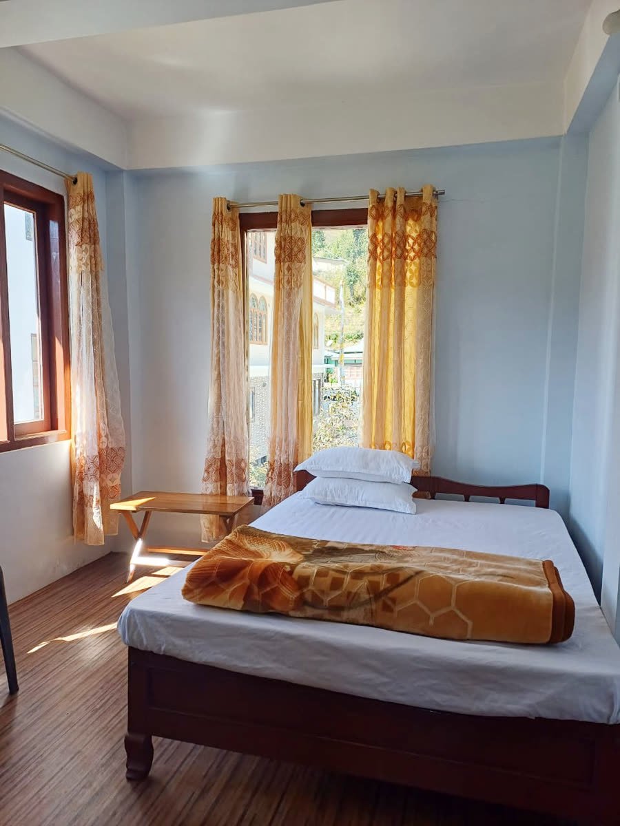 Beautiful view of the room and village at Apple Tree Homestay