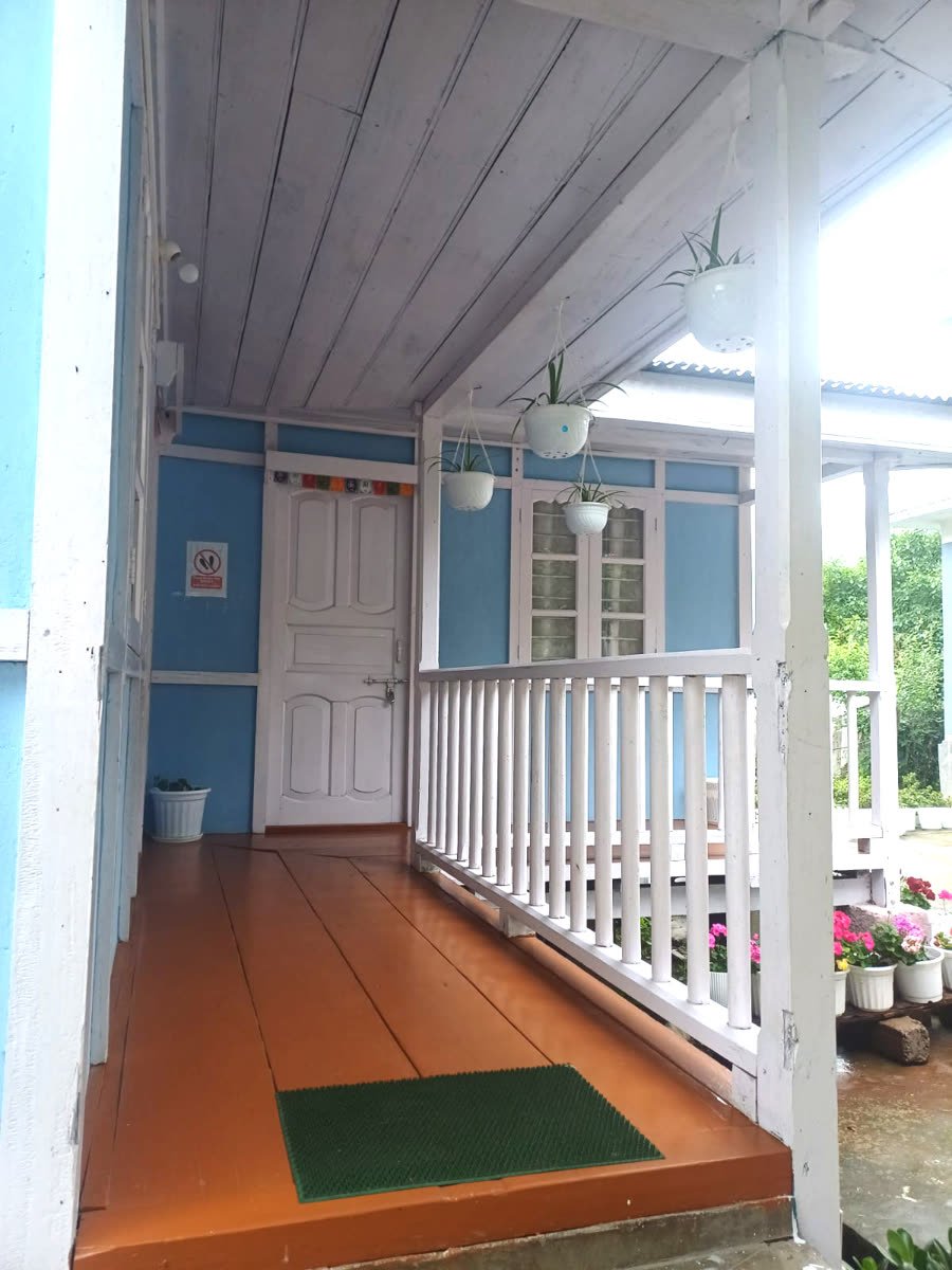 Cosy veranda sitting area at Apple Tree Homestay
